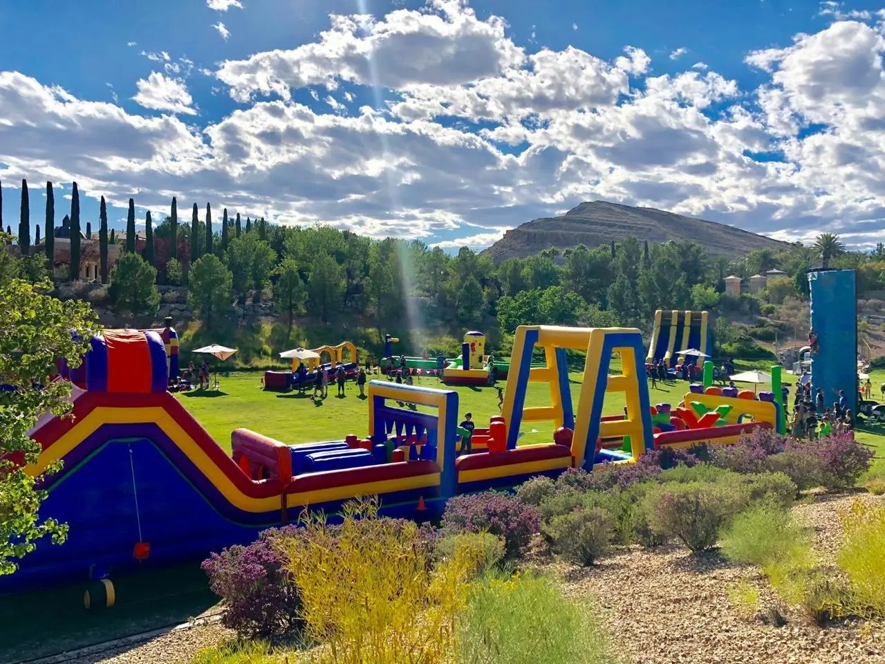Large Outdoor Event Multiple Inflatable Obstacle Courses Slides Children Playing Las Vegas