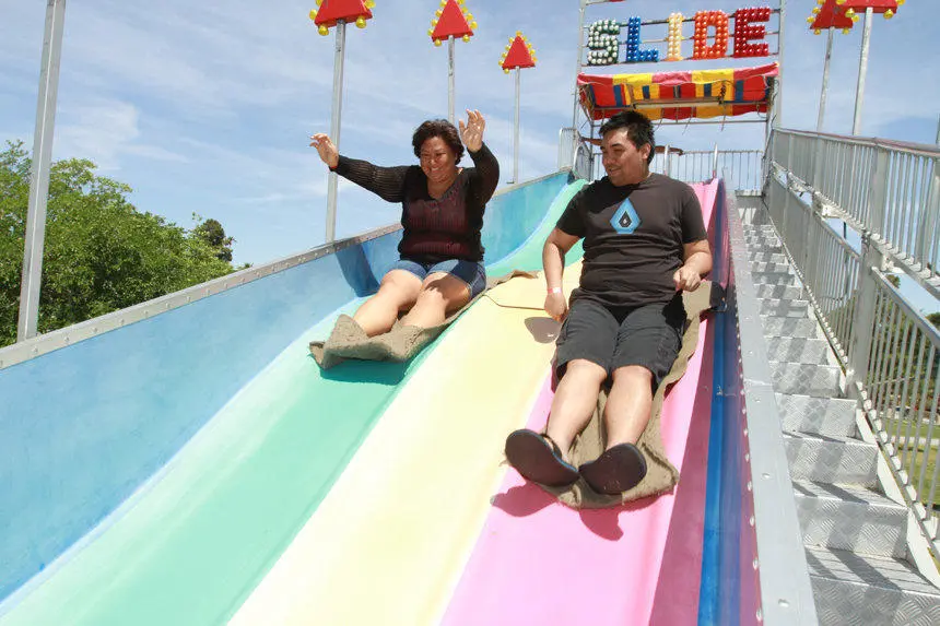 Multi Colored Inflatable Slide Adults Sliding Down Event Production Las Vegas