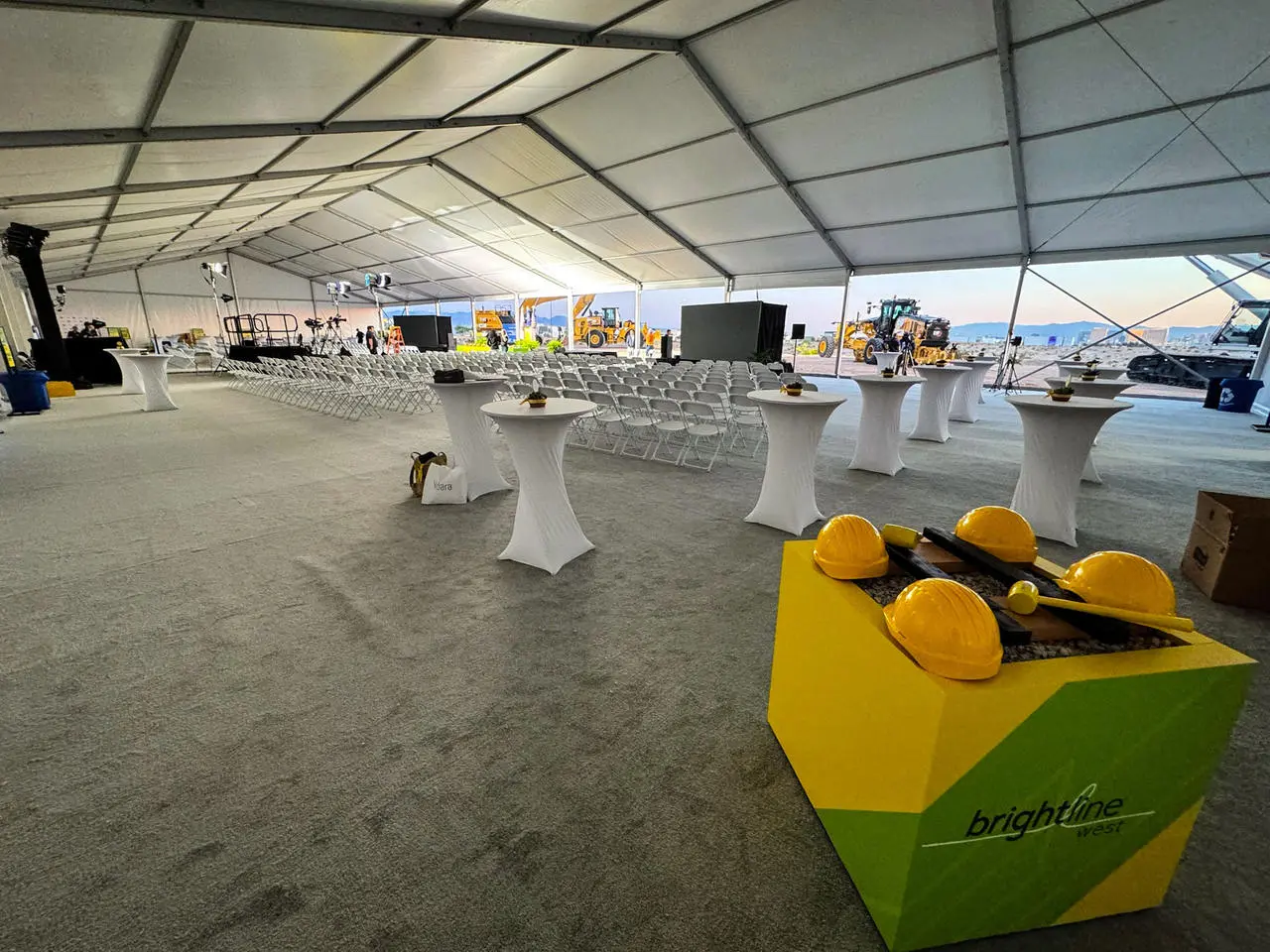 Brightline West groundbreaking ceremony tent interior with event production setup in Las Vegas