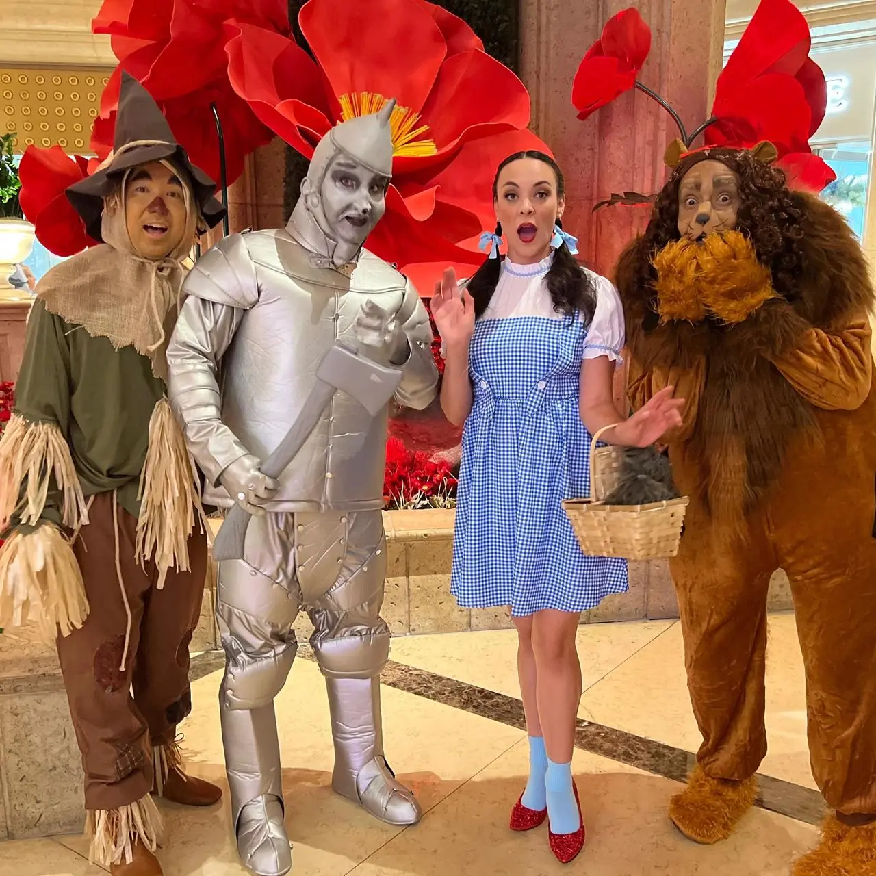 Wizard of Oz character entertainment with red poppy backdrop for events in Las Vegas